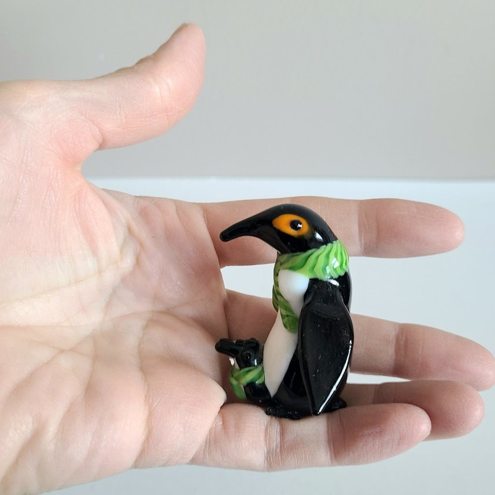 Glass Penguin with baby figurine.